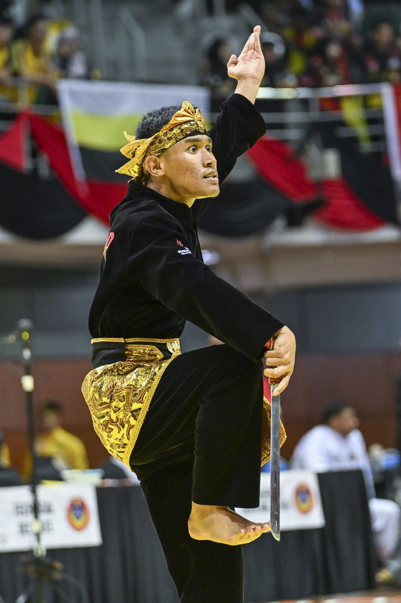 Hard-earned glory: Mohd Aliff Damien Mohd Redzuan in action during the final. — IZZRAFIQ ALIAS/The Star
