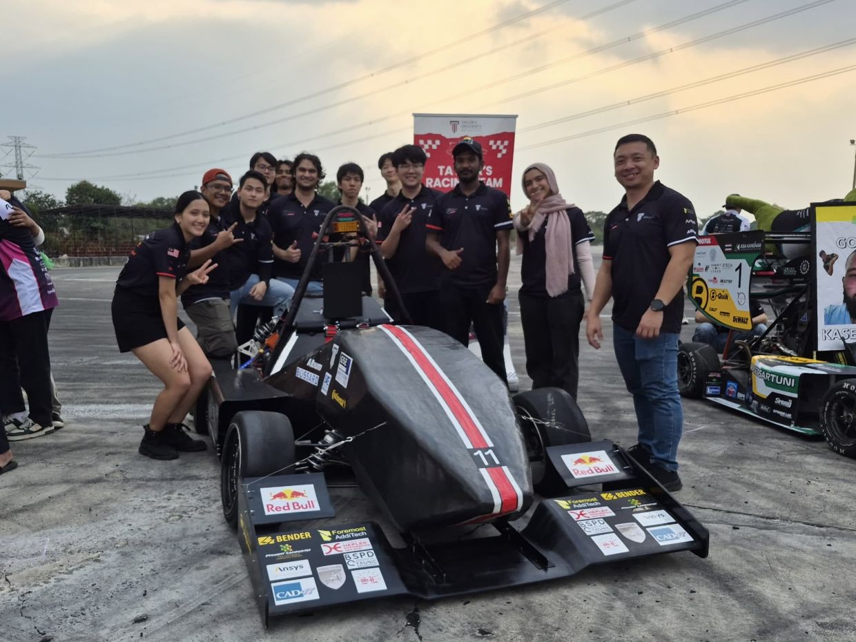 Members of the Taylor's Racing Team with the Formula-style race car they designed, built and raced at the Thailand SAE Auto Challenge 2026, held from Feb 5 to 7.