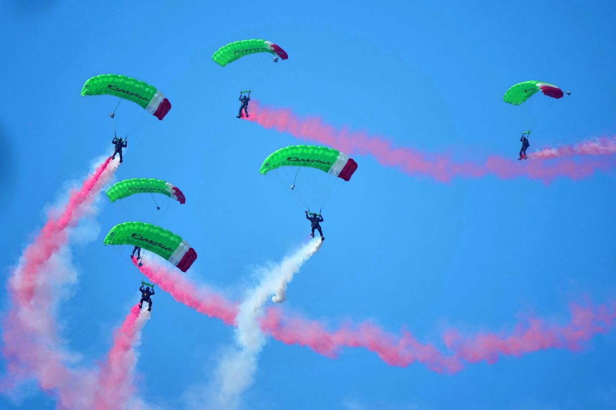 Indonesian special forces skydivers perform during a flag-hoisting ceremony commemorating the country's 81st anniversary of independence at Merdeka Palace in Jakarta, Indonesia, on Monday, Aug. 17, 2026. -- AP Photo/Tatan Syuflana