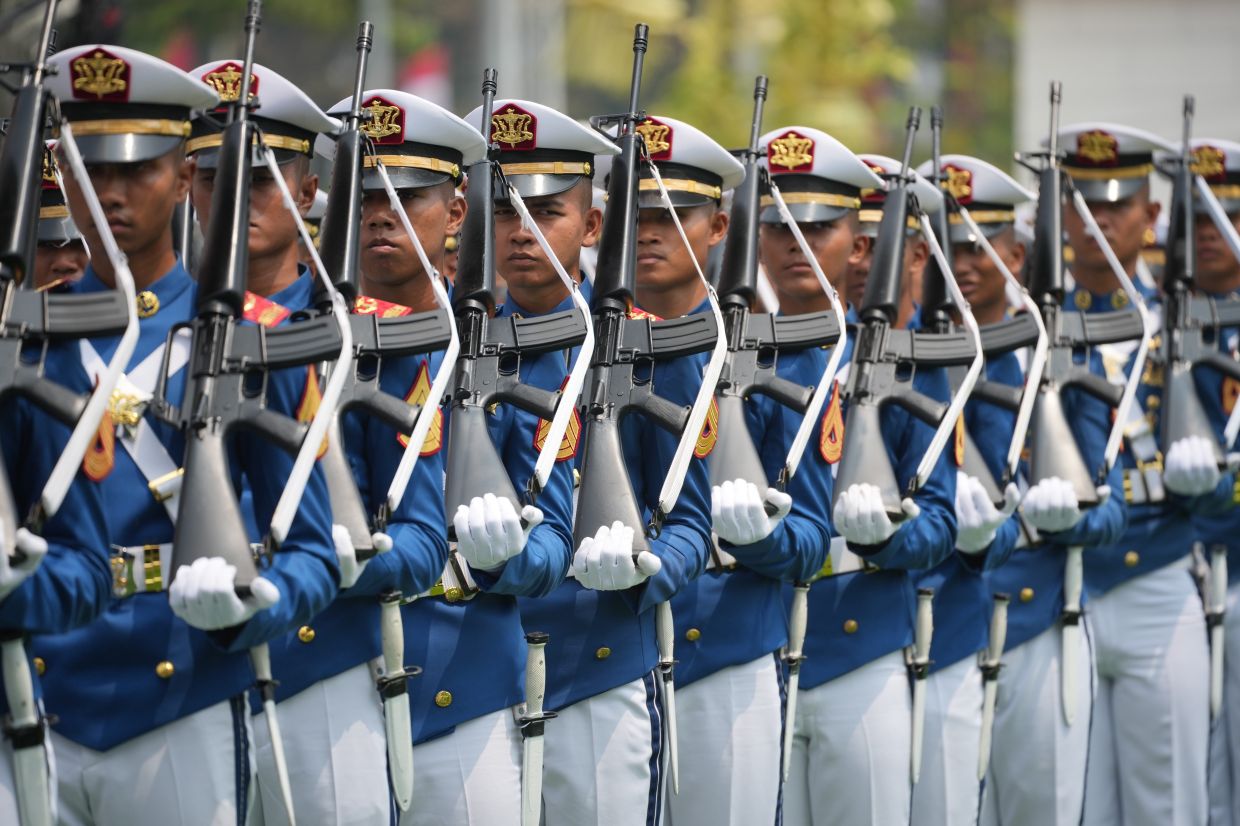 Indonesian Military Academy cadets march during a flag-hoisting ceremony commemorating the country's 81st anniversary of independence at Merdeka Palace in Jakarta, Indonesia, on Monday, Aug. 17, 2026. -- AP Photo/Tatan Syuflana