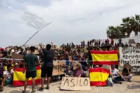 In Spain's Ceuta, hundreds of migrants stage protest and demand asylum