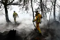 Rainfall offers new hope in fight against Belgium's biggest wildfire