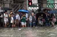 Heavy rains kill one in South Korea and flood major streets in the Philippines; millions affected
