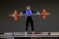 Golden lift for Nurqalida with mum in stands