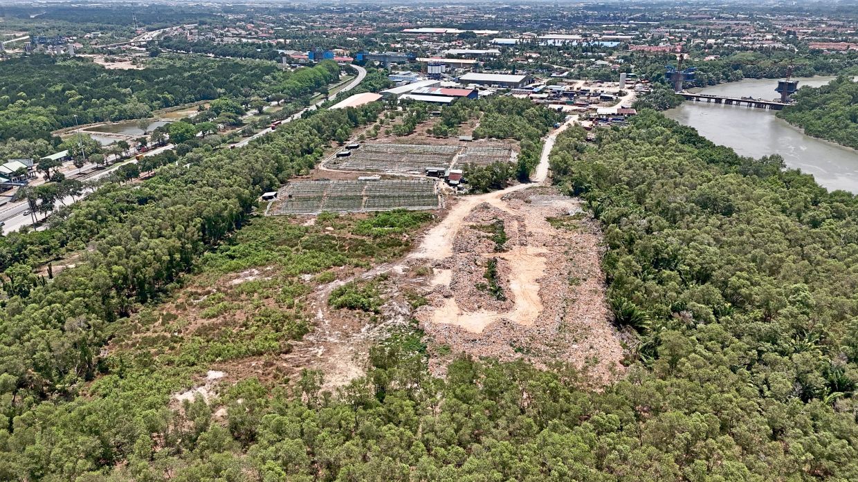 Aerial view of the former Telok Kapas landfill. The rehabilitation project is deemed significant to address leachate that has polluted rivers around the area. — Filepic