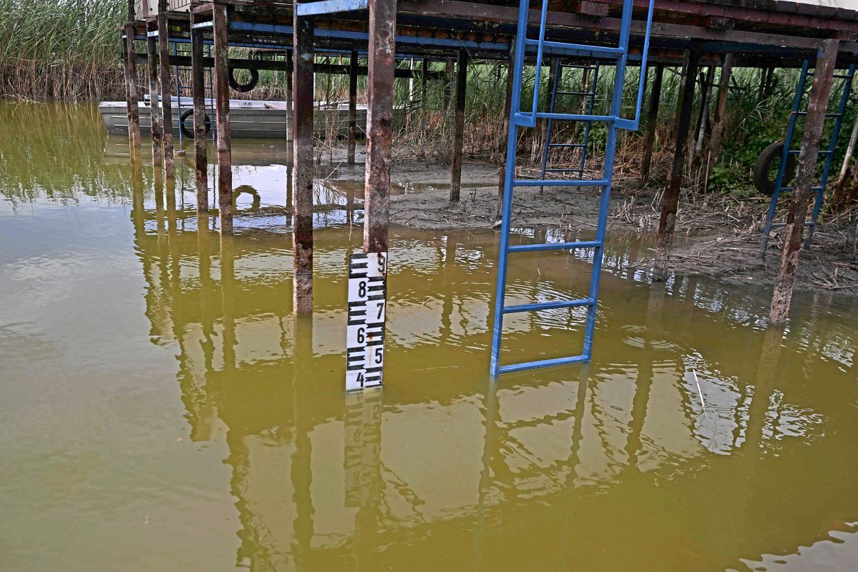 A gauge showing the water level of Lake Velence. — AFP