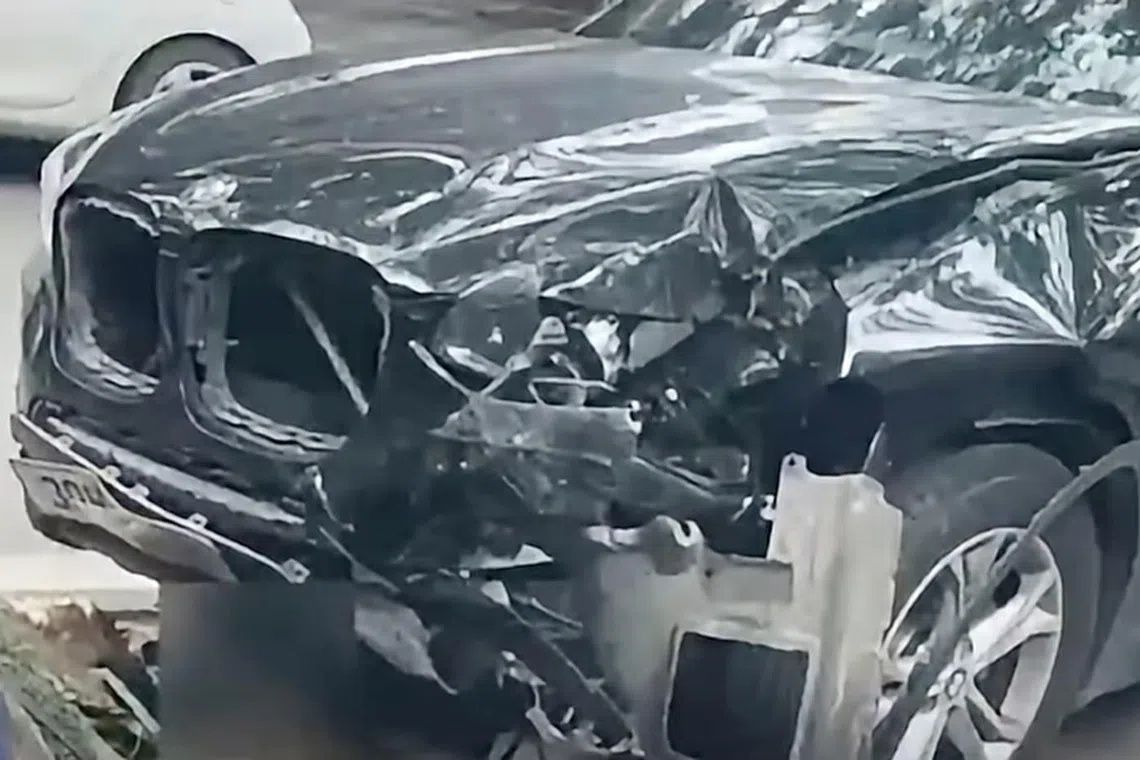 Screenshot from VTV’s report that showed the state of the BMW involved in a fatal car crash. - Photo: VIETNAM TV (VTV/Facebook)