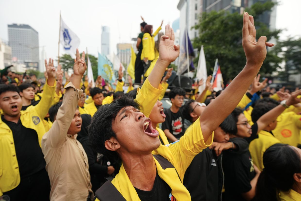 Student protesters shout slogans during a rally against the government's spending policies and what they described as the growing role of the military in civilian affairs in Jakarta, Indonesia, Tuesday, Aug. 18, 2026. -- AP Photo/Tatan Syuflana