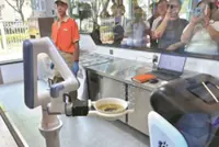 At this Beijing restaurant, robots make and cook your noodles, and deliver them to your table
