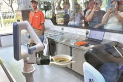 At this Beijing restaurant, robots make and cook your noodles, and deliver them to your table