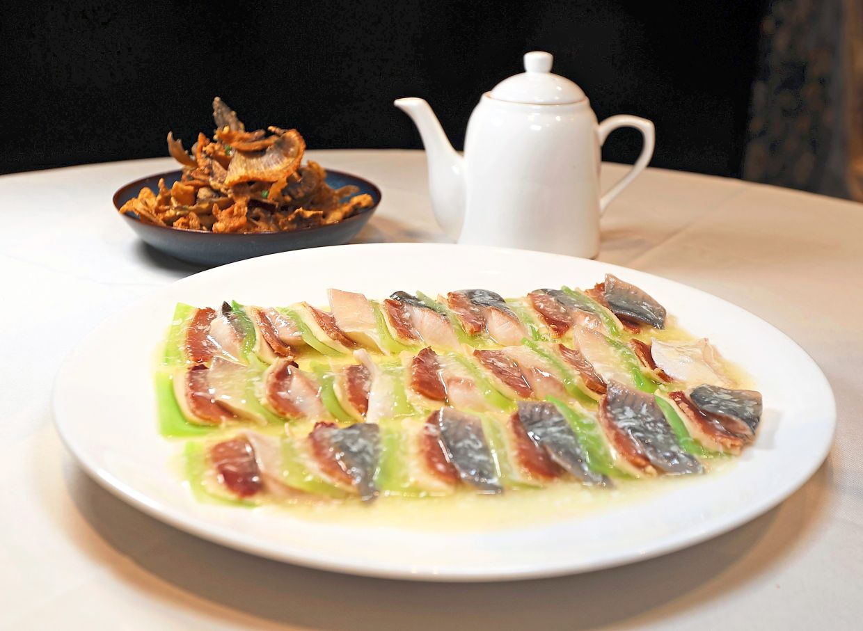 Steamed Pantai Remis Pomfret Qilin Style.