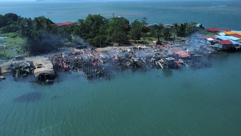 Firefighters save 162 houses after blaze destroys 28 homes in Sandakan water village
