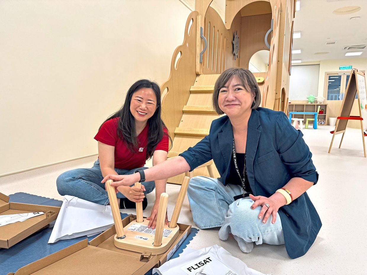 Ngiam (left) pictured with Low at Ruang Play, a space where underserved children aged zero to five and their parents can learn and grow together.