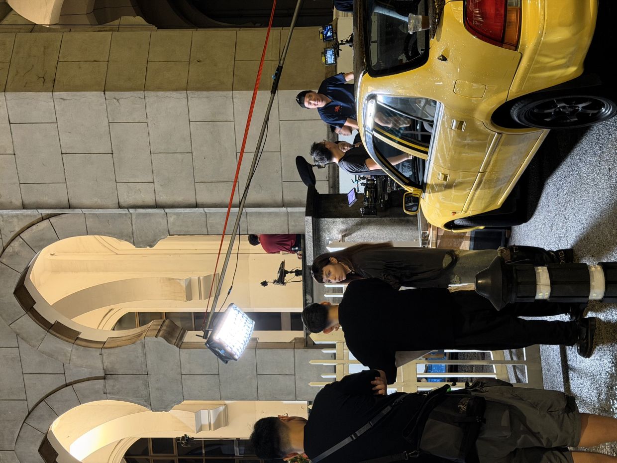 Vivian Sung talks to the director for her scene filmed in Kuala Lumpur.