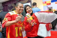 Sabrina gives dad a lift by winning silver