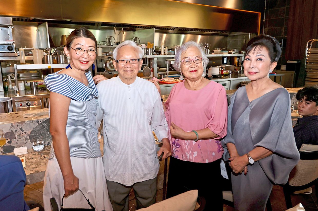 Lai (right) with guests at the high tea.