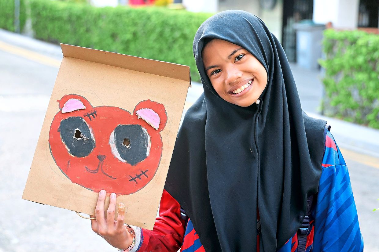 Form One student Nur Dayana from Skudai, says mask-making is a new experience for her.