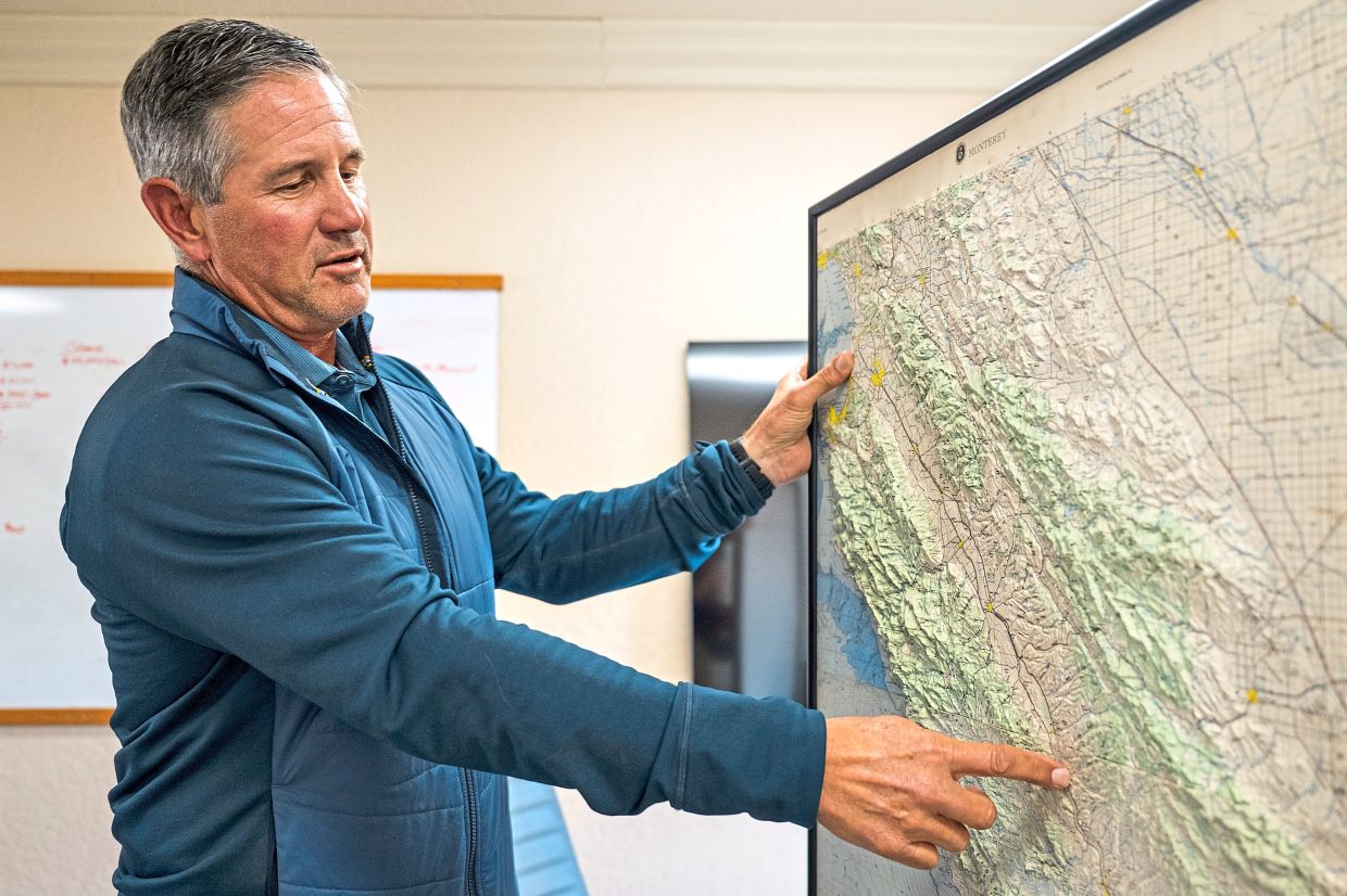 Smith showing the Santa Lucia Highlands wine region on a map in Soledad. He recently decided to sell all of his land and shut down his family’s business. — Nic Coury/The New York Times