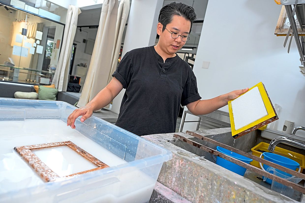 Soo uses a mould and deckle to form the paper sheets.