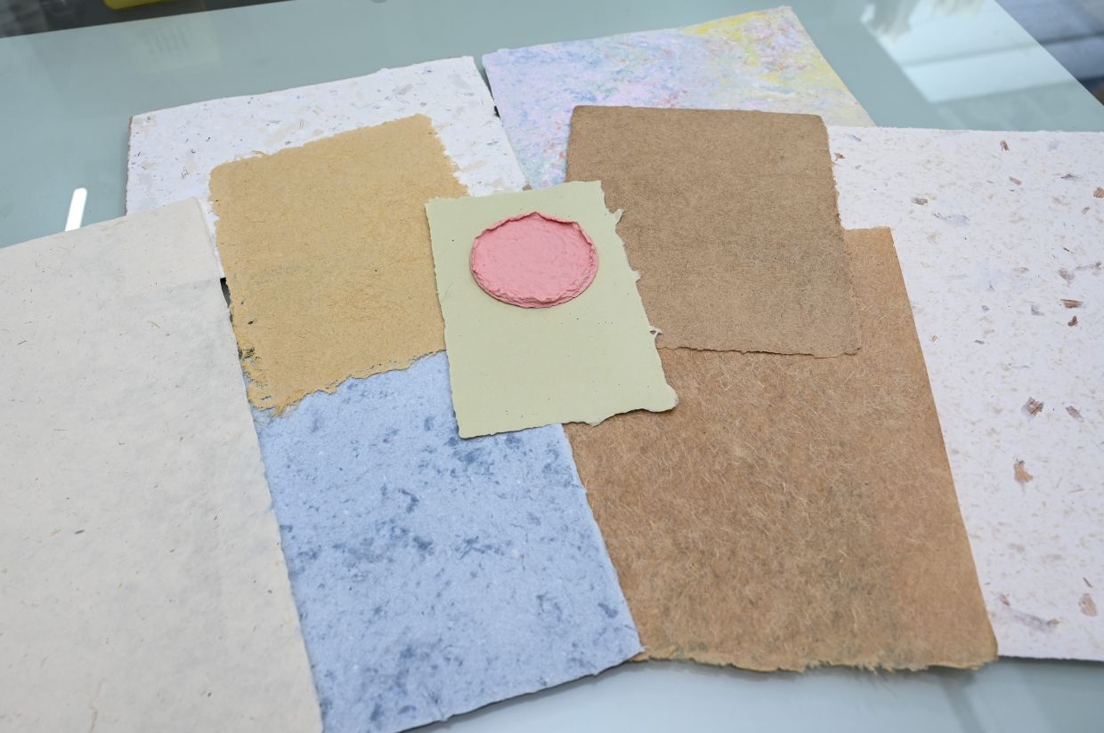 Sustainable handmade paper made using natural fibers like sugar cane waste, corn husks, jeans cloth, screwpine leaves and onion skin. 