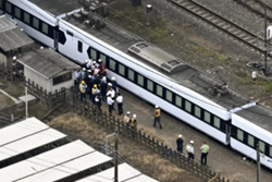 Japan train hits station workers, killing four