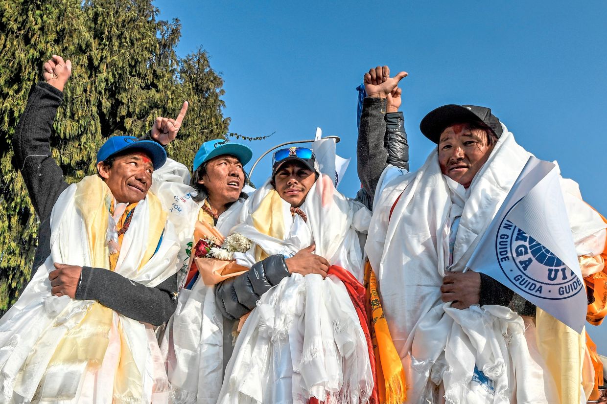 (From left:) Nepali mountaineers Dawa Tenjin Sherpa, Mingma Gyalje Sherpa, Purja and Pem Chhiri Sherpa at Kathmandu’s Tribhuvan International Airport on Jan 26, 2021 after becoming the first team to summit Pakistan’s K2 mountain in winter.