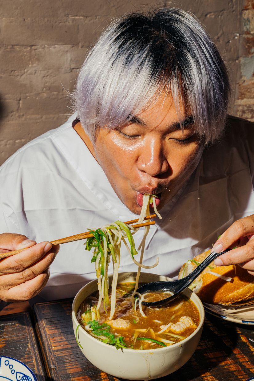 Despite the summer heat, diners can’t resist the bún riêu, a crab noodle soup, at Bánh Anh Em in the East Village of Manhattan on Aug. 7, 2026. — Photo: Janice Chung/The New York Times
