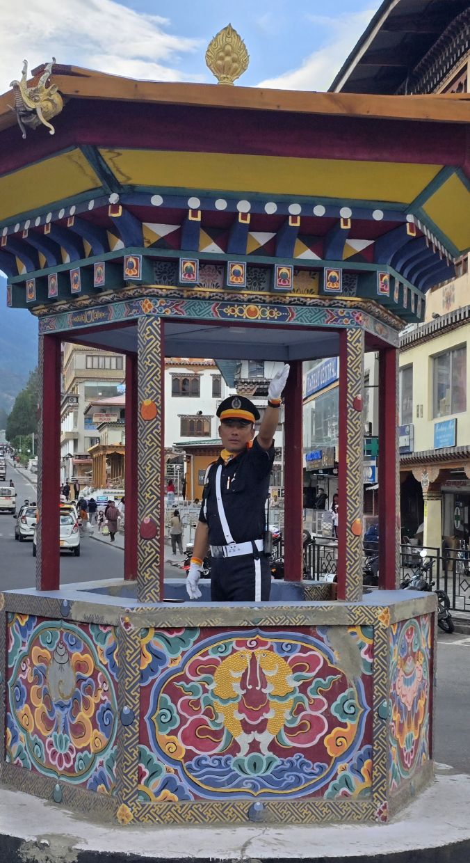 Tourists love taking pictures and videos of this special traffic police booth at Thimphu.