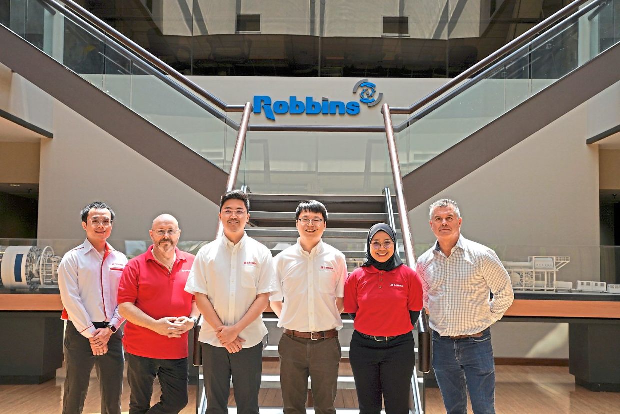 Gamuda’s tunnelling team with Chorley (far right) at Robbins’ headquarters in Ohio, the United States.