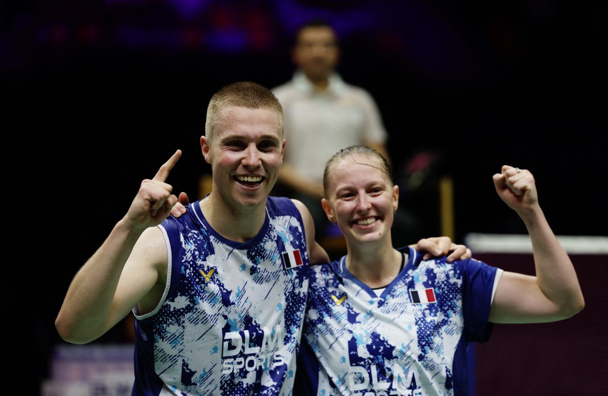 France's Thom Gicquel and Delphine Delrue celebrate after winning their mixed doubles semi final match at the World Championships. - Reuters.