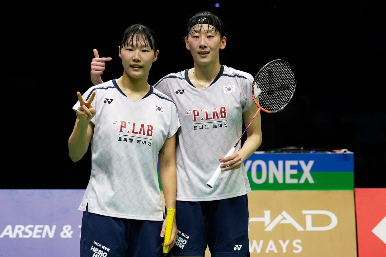 South Korea's Baek Ha Na, left, and Lee So Hee pose for a photograph after winning against China's Li Yi Jing and Luo Xu Min during a semi final match of the Badminton World Championships in New Delhi, India, on Saturday, Aug. 22, 2026. -- AP Photo/Manish Swarup