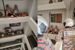 Fear of heights freezes two men on 14th-floor ledge before firefighters intervene