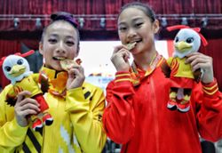 Kang Xian lets her gymnastics do the talking with vault gold