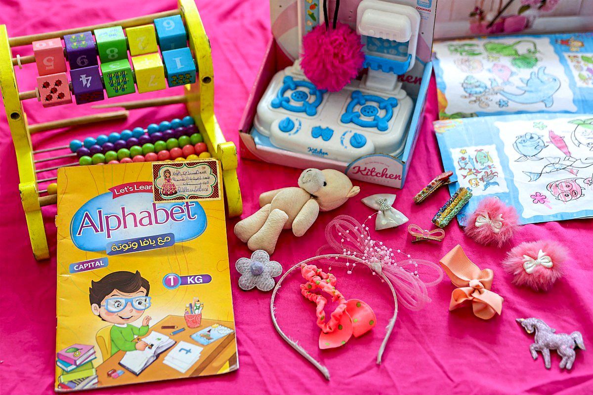 Hind's belongings displayed on a bed at the family's home in the Daraj neighbourhood of Gaza City on Aug 20, 2026. — AFP