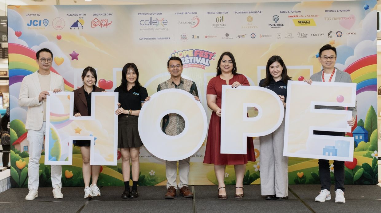 Guests hold up the letters spelling “HOPE” during the official launch of HopeFest 2026. From left: Collexe Consulting Managing Partner Chong Li Ken; JCI Petaling Jaya President Gabby Wong; HopeFest 2026 Organising Chairperson Gazel Ho; Petaling Jaya MP Lee Chean Chung; MBPJ Zone 19 Councillor Nalina Nair, representing Kampung Tunku State Assemblywoman Lim Yi Wei; JCI Malaysia 2026 National Executive Vice President Maegann Yap; and Paradigm Mall General Manager Foong Khar Mun.