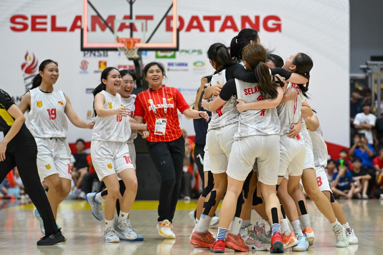 We did it: Selangor team celebrate after beating Negri Sembilan for the women’s basketball 5x5 gold. - IZZRAFIQ ALIAS/The Star