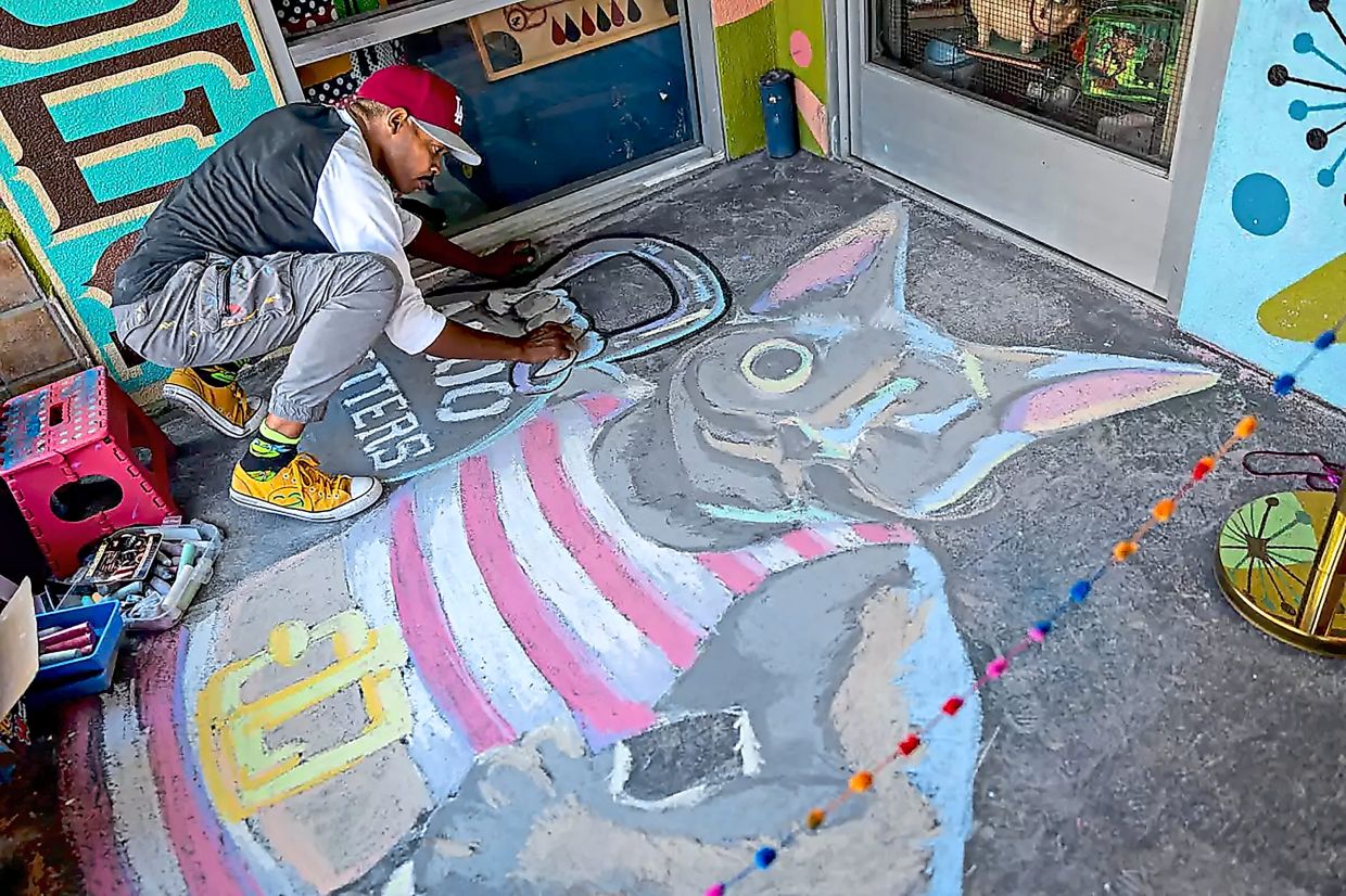 LaJon Miller, who calls Likho his muse, paints a portrait of the cat.