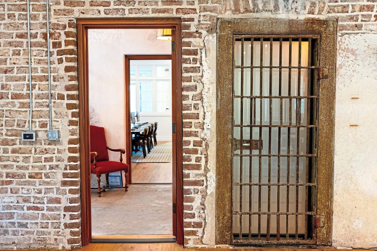 The offices are on the second floor of the Old Jail, with vestiges of the building’s former purpose evident.