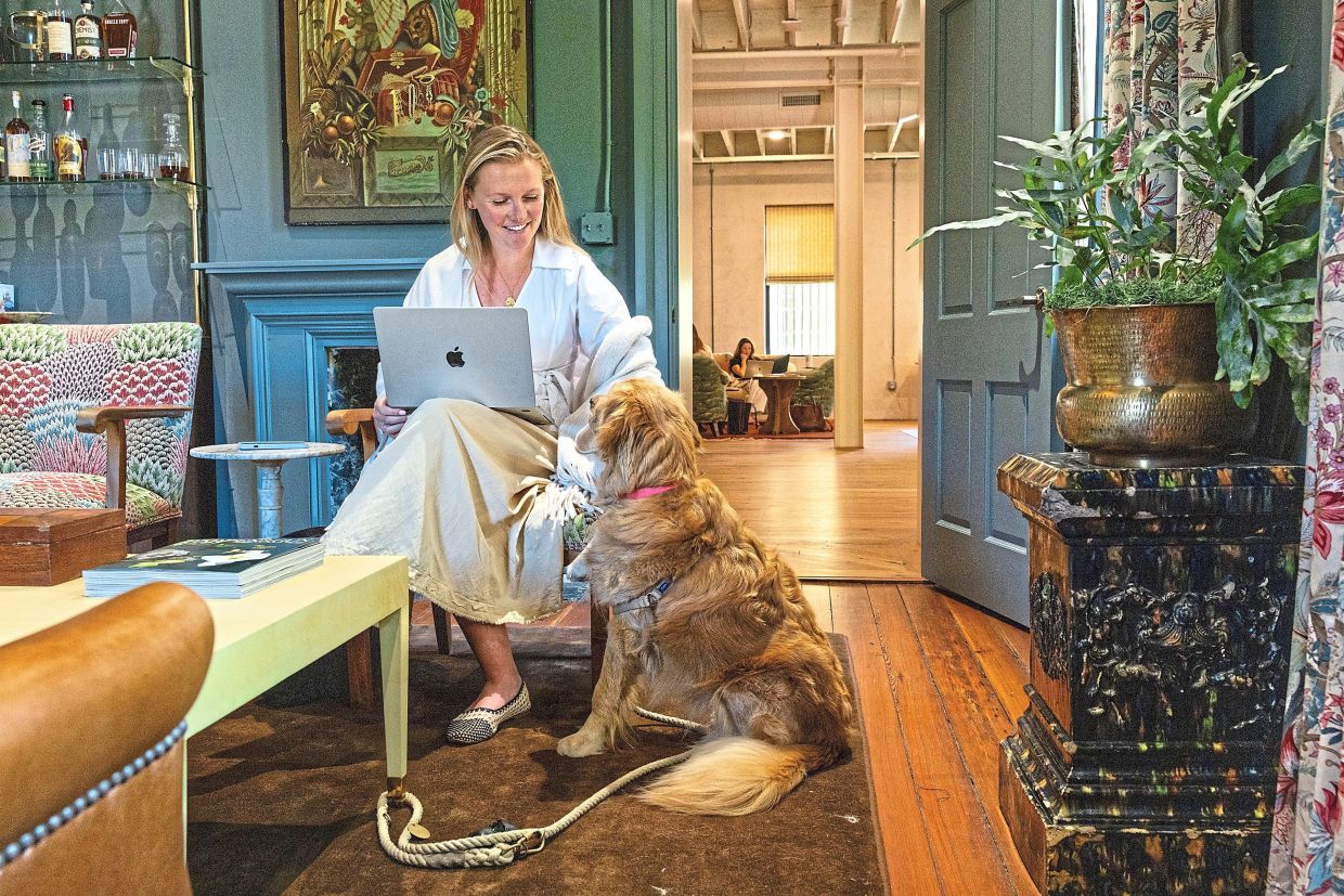 Catherine Owen, the magazine’s associate brand marketing manager, at work in the lounge area.