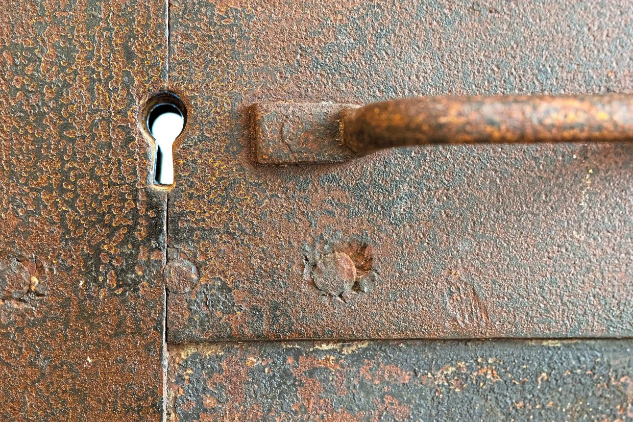 A keyhole on an old iron door on the third floor of the new headquarters.