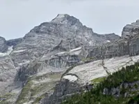 Looming rock collapse threatens Swiss village as thawing permafrost destabilises Alps