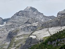Looming rock collapse threatens Swiss village as thawing permafrost destabilises Alps