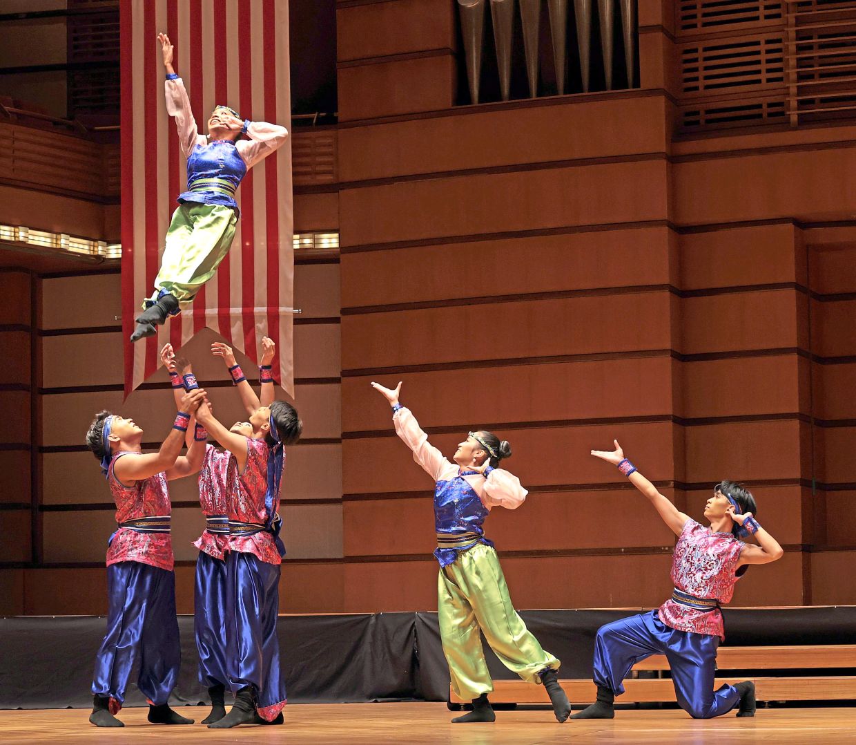 A dancer from ADC being tossed into the air during an excerpt from ‘Pearl of the Orient’ performance which will be part of the showcase.