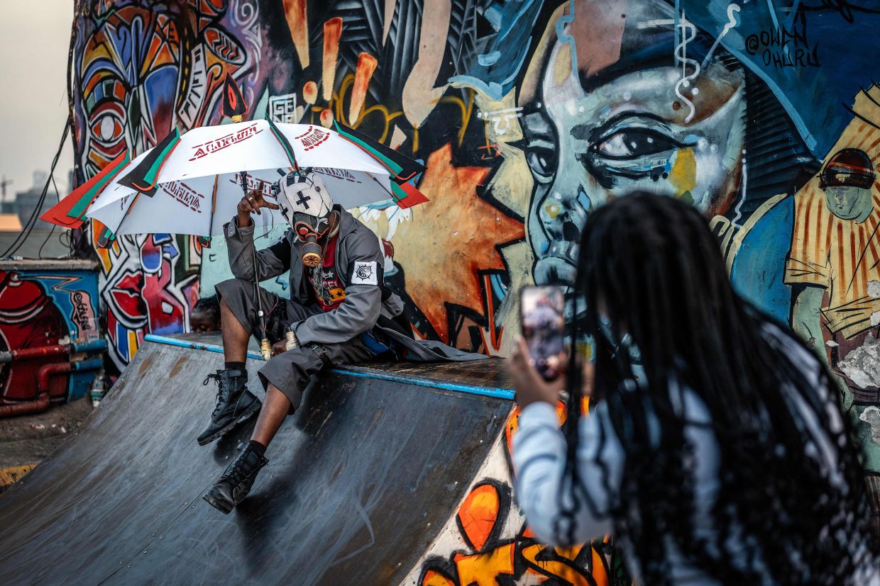 Cosplayer Julius Mokaya, 34, poses while creating social media content as Enjin, a character from the popular manga series 'Gachiakuta', ahead of the recent Otamatsuri convention in Nairobi. Photo: AFP