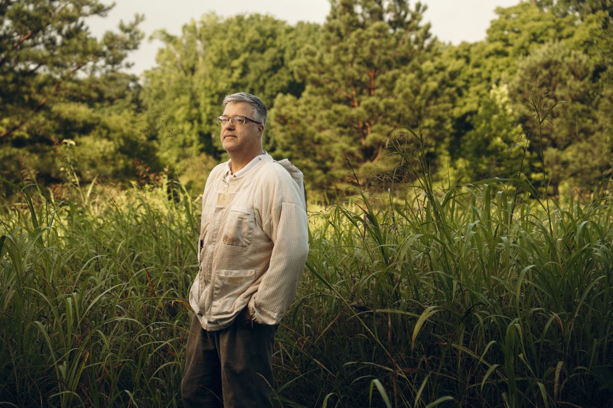 Dr. Jörg Mayer, professor at the University of Georgia College of Veterinary Medicine, stands near the university apiary in Athens, Ga., June 18, 2025. Veterinarians are gingerly embracing the honeybee, a vital pollinator for agriculture but one that’s in increasing danger. (Will Crooks/The New York Times)