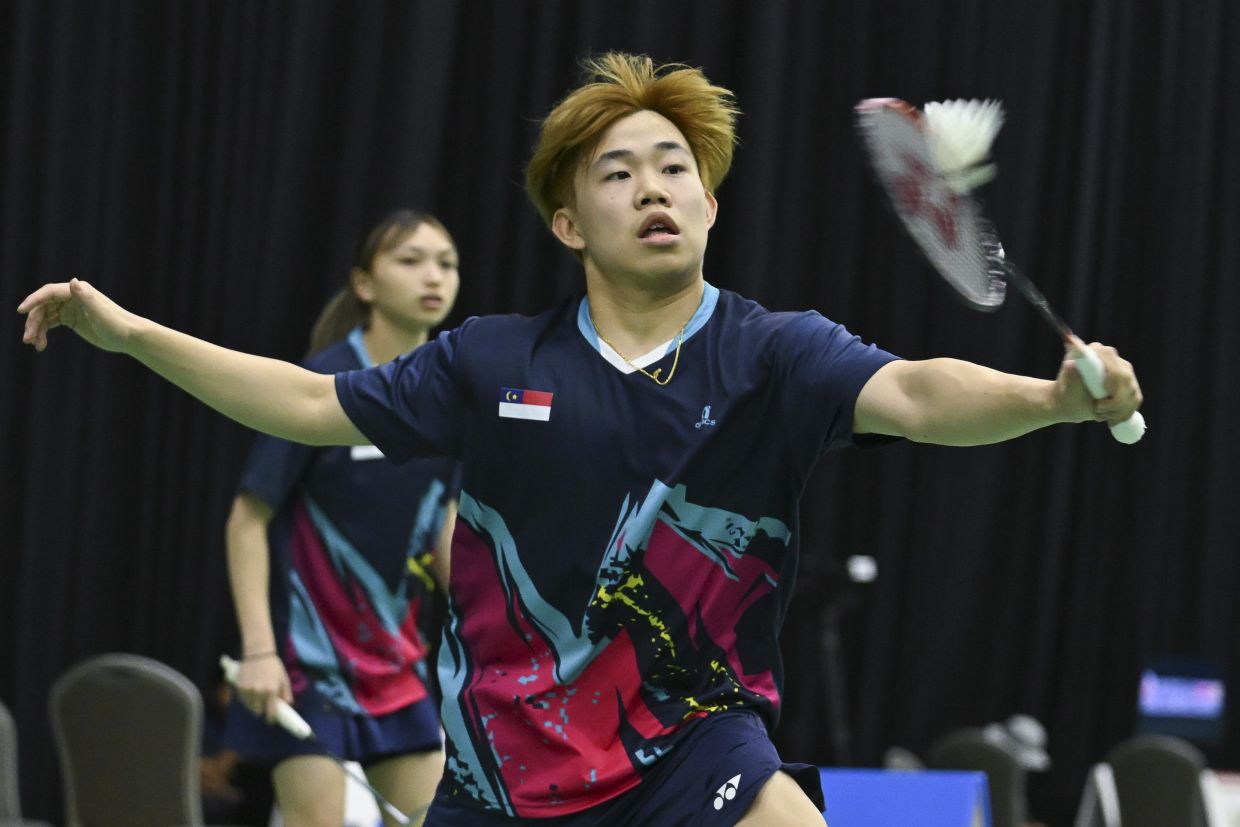 Melaka’s Aaron Tai-Noraqilah Maisarah Ramdan in action against Kelantan’s kang Khai Xing-Chan Wen Tse during the Malaysia Games (Sukma). — IZZRAFIQ ALIAS/The Star