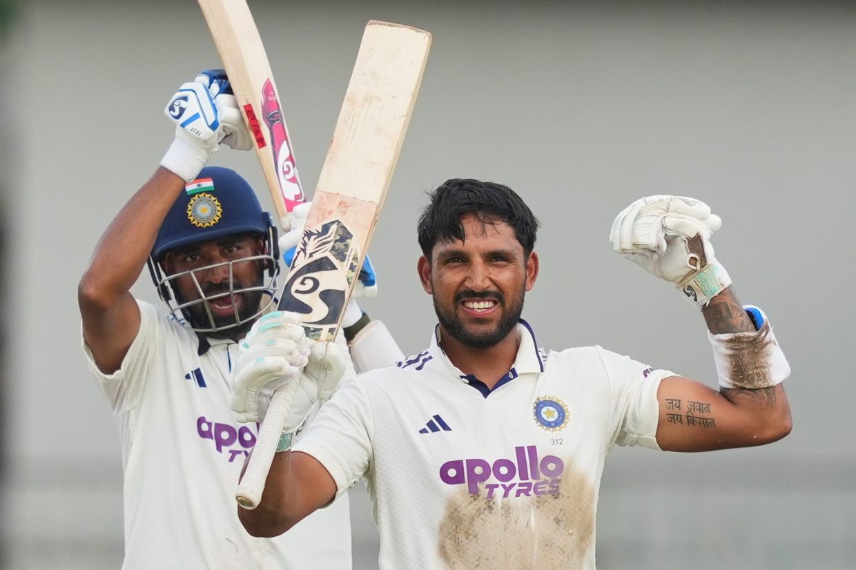 India's Dhruv Jurel celebrates his century as batting partner, India's Mohammed Siraj (left) watches during day two of the second cricket Test match between Sri Lanka and India in Colombo, Sri Lanka, on Monday, Aug. 24, 2026. -- AP Photo/Eranga Jayawardena