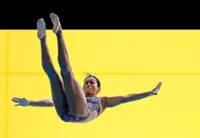 Gymnast-turned-diver stuns national stars to strike springboard gold