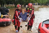 Typhoon Narra wreaks havoc in Vietnam and China as torrential rains lead to floods; more than 50,000 relocated