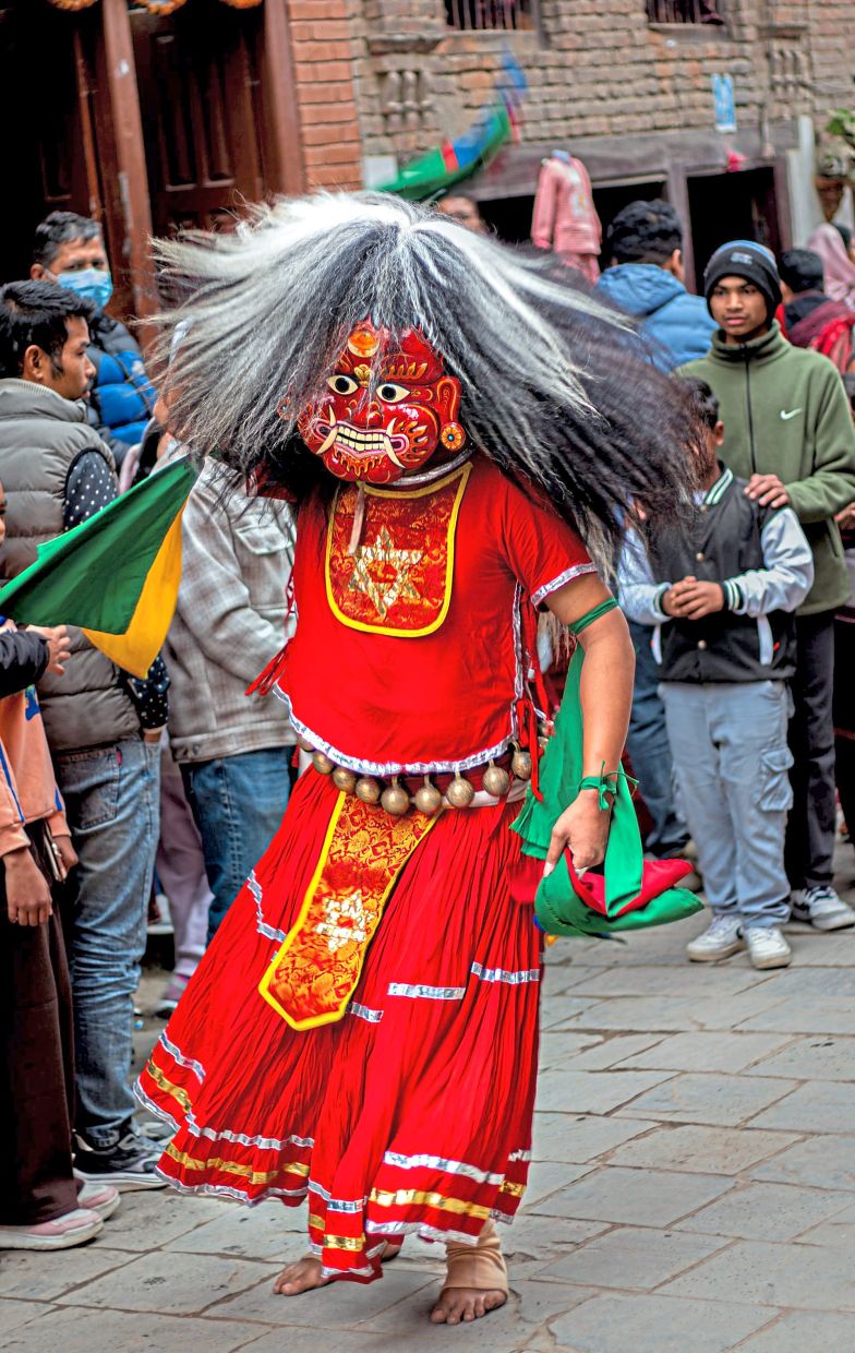A person dressed as the fearful spirit Lakhe (or Lakhey) performing a dance during a festival in Limbu, Nepal.